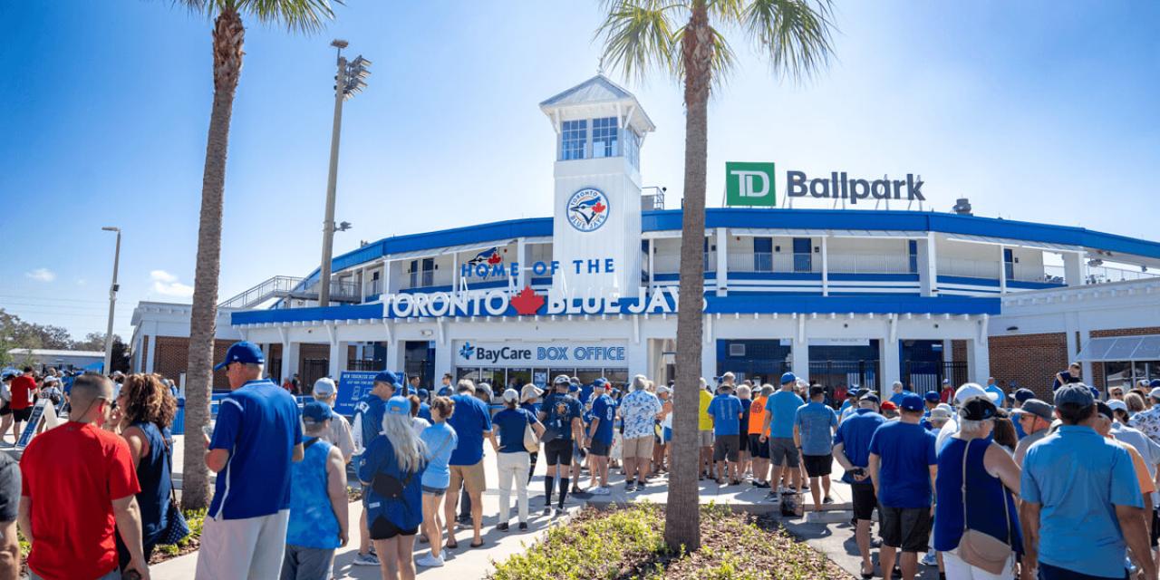 Baseball fans line up to enter the TD Ballpark